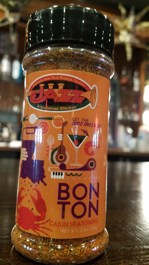 A jar of Cajun BonTon seasoning sitting on a table in a New Orleans restaurant. A New Orleans Bistro Restaurant near me