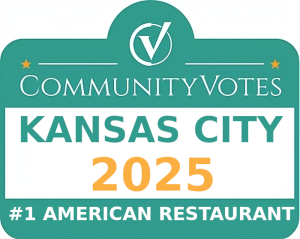 Jazz - A Louisiana Kitchen A green and white sign reads “CommunityVotes Kansas City 2025 #1 American Restaurant” with a checkmark logo at the top. Kansas City, Columbia, cajun food restaurant near me