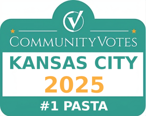 Jazz - A Louisiana Kitchen A teal sign reads "CommunityVotes Kansas City 2025 #1 Pasta" with a checkmark logo at the top. Kansas City, Columbia, cajun food restaurant near me
